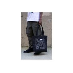 Our oversized tote bag is designed to be durable for your daily needs.The front and back are adorned with Basquiat's album cover artwork Beat Bop. 100% heavy duck canvas in black Lined with 100% cotton Cotton webbing handles 18x17 inches (45.7x43.2 cm) Made in the USA About the artwork: One of Jean-Michel Basquiat's most coveted works is from the record album artwork of the early hip-hop record Beat Bop that JMB produced and self-financed. Released under his own Tartown record label, the origina Urban Tote Bag For Streetwear, Urban Streetwear Tote Bag, Rectangular Canvas Streetwear Bags, Canvas Tote Bag For Streetwear, Rectangular Canvas Bags For Streetwear, Graphic Print Tote Bag For Streetwear, Black Cotton Canvas School Bag, Black Cotton Bag For Streetwear, Black Rectangular Canvas Bag With Graphic Print