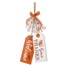 two thanksgiving tags hanging from twine with ribbon and bow on white background, one says thanks to all those who have served us