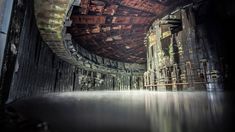 the inside of an abandoned building with water running through it