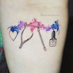 a tattoo with nail polish and heart shaped objects on the side of her thigh,