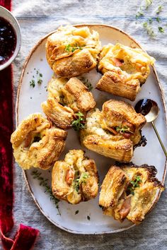 small pastries on a plate with dipping sauce