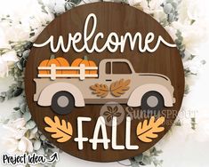 a sign that says welcome fall with an old truck and pumpkins