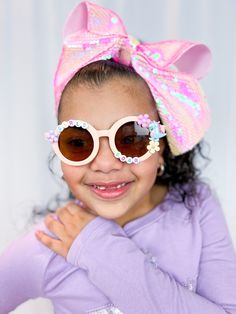 This cute toddler sunglasses are inspired for international woman's  day!   They are perfect accessory for your little girl!  Ready to ship as soon as you placed your order! This embellished Sunglasses are made individually by hand. There may be slight variations in the figures, placement and beads colors.  These fashionable sunglasses are available in Purple heart shaped and light pink rounded shaped.  Comfortable to wear  Sunglasses lens optical are UV400. This size fits up to 10yrs International Woman's Day, Sunglasses For Girls, Embellished Sunglasses, Fashionable Sunglasses, Frederick Md, Girl With Sunglasses, Girls Gift, Woman’s Day, Purple Heart