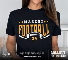 a woman wearing a black shirt with the words mascott football in gold on it