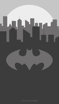 the batman symbol in front of a cityscape