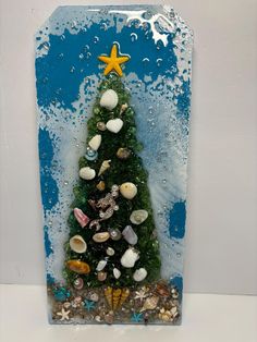 a small christmas tree made out of sea shells