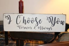 a wooden sign that says i choose you forever and always on top of a chair