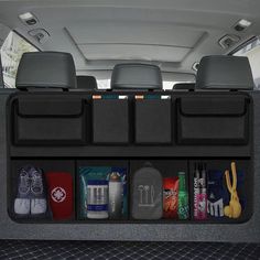 the back compartment of a car with various items in it