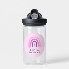 a clear water bottle with a black lid and a rainbow sticker on the side