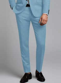 Give yourself a modish look with our Marco Stretch Pastel Blue Wool Suit. Meticulously fashioned from a wool blend, it boasts a delightful amount of stretch for that added touch of freedom. The pastel blue hue with a solid pattern offers a refreshing twist without veering into overly bold territory. Whether you're turning heads at a social gathering or aiming to infuse a dash of personality into your everyday style, this suit effortlessly takes center stage as your go-to chic upgrade.   Look Inc Blue Slim Fit Suits With Welt Pockets, Slim Fit Blue Suits For Workwear, Slim Fit Blue Suit For Work, Blue Fitted Suit In Suiting Fabric, Fitted Blue Suit In Suiting Fabric, Fitted Suits In Suiting Fabric For Spring, Fitted Suiting Fabric Suits For Spring, Fitted Spring Suits In Suiting Fabric, Fitted Spring Suits