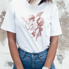 a woman wearing a t - shirt with an angel on it