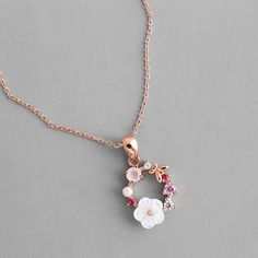 The butterfly is a deep and powerful representation of new life and reinventing yourself. Flaunt your whimsical charm in our Butterfly Pink Multi-Stone Rose Gold Necklace which shows off a stunning grouping of CZ stones in shades of pink, a sweet pearl, a gorgeous hibiscus resin flower and lovely rose gold butterfly which sits delicately in a circular shape. DETAILS & SIZE Composition: rose gold plated over copper; 3-7mm CZ crystals, 4mm faux pearl, 8mm resin flower, 6mm rose gold butterfly Beaded Jewelry Necklaces, Rose Gold Flower, Romantic Jewellery, Flower Pendant Necklace, Circle Necklace, Butterfly Flowers, Gold Plated Necklace, Rose Gold Necklace, Crystal Pearls