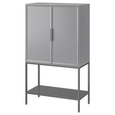 a gray cabinet sitting on top of a metal shelf