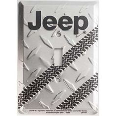 a jeep license plate with the word jeep in black and white on it's side