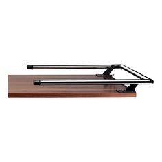 a wooden desk with a metal object on it's top and two black handles