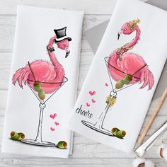 two towels with pink flamingos in martini glasses