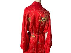 "Vintage red kimono, tag says 100% rayon, made in Japan. Robe is lined, has gold dragon design, matching belt with tassels. Robe has loose gold threads, other than that is in great condition, measurements are shoulder to shoulder 20\" bust up to 38\" waist up to 30\" length 51\" sleeve length 15.5\"" Traditional Red Robe With Long Sleeves, Traditional Long Red Robe, Traditional Red Long Sleeve Robe, Traditional Long Gold Kimono, Red Vintage Kimono For Spring, Luxury Elegant Red Kimono, Festive Red Embroidered Kimono, Traditional Red Embroidered Kimono, Luxury Vintage Embroidered Kimono