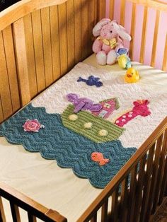 a crib with a teddy bear and stuffed animals on it