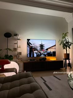 a flat screen tv mounted on the wall in a living room