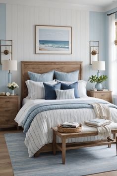 a bedroom with blue and white striped bedding, wooden headboard and foot board