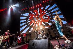 a group of people standing on top of a stage