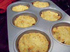 a muffin tin filled with some type of baked item that is ready to go in the oven