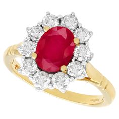 A fine and impressive vintage 1.88 carat natural ruby and 0.70 carat diamond, 18k yellow gold, 18k white gold set cluster ring; part of our vintage jewelry and estate jewelry collections. This impressive vintage ruby ring has been crafted in 18k yellow gold with a 18k white gold setting. The pierced decorated boat style setting displays a feature 1.88Ct oval mixed cut ruby set in subtle relief within four 18k yellow gold claws / prongs encircled by ten modern brilliant round cut, white gold set Vintage Ruby Ring, Boat Style, Ruby Ring Vintage, Ruby Set, White Gold Set, 18k Yellow Gold Ring, Dress Rings, Diamond Cluster Ring, Ruby Ring