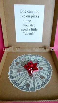 an open box with money in it and a red bow on the lid that says give your graduate a gift