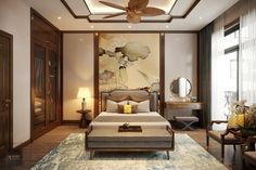 a bedroom with a large bed sitting under a ceiling fan