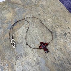 This beautiful Murano glass cross pendant hangs on natural cotton cord along with sterling silver accent beads. Finished with a sterling silver S hook clasp. 18 inches Cross pendant: 1 x .75 inch To see more from East Village Jewelry~ http://eastvillagejewelry.etsy.com All orders ship out within 24 hours, excluding holidays and Sundays Feel free to contact me with any questions. Use coupon code VILLAGE14 for 10% off all orders over $200.00 THIS ITEM WILL SHIP OUT WITHIN 24 HOURS OF ORDERING FREE Star Cross, Labradorite Bracelet, Bride And Groom Gifts, Hook Clasp, Strand Bracelet, Cross Pendant Necklace, Silver Accents, Multi Strand, Natural Pearls