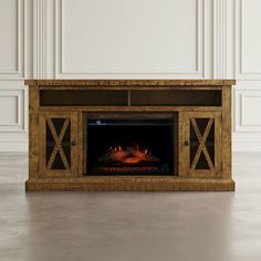 an entertainment center with a fireplace in it