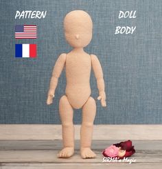 a knitted doll standing in front of a wall with the words pattern, doll body