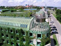 an aerial view of a green building with lots of plants growing on it's roof