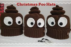 three crocheted christmas poo hats with eyes and noses on them, sitting on a white blanket