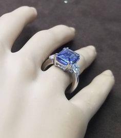 GORGEOUS 14k white gold engagement tanzanite rlin emerald shape Center natural tanzanite in emerald weight 6.32ct. size 13x8.6mm gorgeous violet blue color nice luster very lively ,brilliant spakly and clean. side two natural diamonds total weight 1.17ct. Size 5.3mm H -SI1 ring size 6 Resizable Appraisal available Retail value $9,500 net . Emerald Ring Vintage, Filigree Engagement Ring, White Gold Engagement Ring, Natural Tanzanite, Filigree Ring, White Gold Engagement Rings, White Gold Engagement, Gold Engagement Ring, Emerald Ring