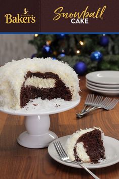 a chocolate cake with white frosting on a table