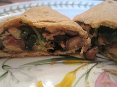 a cut in half sandwich sitting on top of a plate