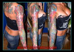 the woman is showing off her tattoos on her arm and leg, while wearing jeans