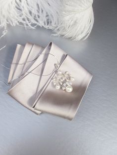 "This delicate floral pendant is hand made using Premium Quality European Crystal and fine quality cultured freshwater pearls. Available in gold, rose gold or silver finish. The pendant measures 1 3/4\" long and 1 1/4\" wide. The necklace is 18\" long. For the matching earrings please take a look here: https://www.etsy.com/listing/684400559/bridal-pearl-earrings-crystal-and?click_key=e783273204a3125b36345a6867ca87f500487c95%3A684400559&click_sum=f5090d17&ref=shop_home_active_66&frs=1 https://www Elegant Rose Gold Necklace For Mother Of The Bride, Elegant Pendant Pearl Necklace Gift, Elegant Pearl Necklaces For Gifts, Elegant Pearl Necklaces As Gift, Elegant Sterling Silver Necklace For Wedding Gift, Elegant Bridal Necklace With Pearl Pendant For Anniversary, Pearl Pendant Bridal Necklace Gift, Delicate Pearl-embellished Necklaces As Gifts, Pearl Pendant Bridal Necklace As A Gift