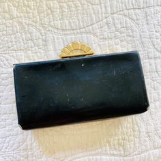 "Vintage antique clutch bag from Evans Elegance brand and line. Art Deco style. These were manufactured in the early 20th century from 1920s 1930s or 1940s. Black leather bag with gold toned hardware made of brass. Hard clamshell style clasp with a gorgeous ornate clasp. These are rare and highly sought after style! This bag shows some light wear, especially around the edges. All show in the photos. Stunning piece that is a timeless classic in your closet! length: 8\" height: 4\" width: 1.5\" AB Retro Rectangular Evening Bag For Formal Occasions, Classic Rectangular Evening Bag For Vintage Events, Vintage Black Rectangular Evening Bag, Vintage Rectangular Evening Bag, Vintage Rectangular Evening Bag For Formal Occasions, Vintage Rectangular Formal Evening Bag, Vintage Clutch Coin Purse, Vintage Black Clutch For Evening, Vintage Black Evening Clutch