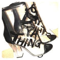 Let Your Look Speak For Itself With The Fun Graphics And Fabulous Translucent Design Of These Gabbi Ankle Booties From Aldo. Round Peep-Toe Ankle Booties. Zipper Closure At Back; Translucent Upper With "Do Ya Thing" Graphics. 4-1/4" Lucite Block Heel. Manmade Upper; Manmade Sole. Color: Black Worn Only Once, Brand New Edgy Ankle-high Spring Heels, Black Trendy Heels For Spring, Trendy Black Heels For Spring, Trendy Black Spring Heels, Tan Round Toe Heels For Evening, Chic Tan High Heels, Edgy Lace-up Heels For Spring, Spring Edgy Heels With Wrapped Heel, Edgy Spring Heels With Wrapped Heel