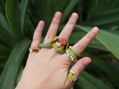 One of a kind, stackable polymer clay rings  *If you would like any of these rings in another size please send me a message through Etsy and I'd be very happy to make a custom sized ring for you! Dimensions: 1. Face / 14mm 2. Green gradient / 21mm 3. Green squiggle / 17mm 4. Green gradient / 17mm 5. Eyes / 16mm 6. Snail / 20mm *This item is sent without tracking  How to care for your rings: - Do not wear your rings while swimming and showering - Clean rings with a damp cloth or soft fabric - Sto Polymer Ring, Polymer Clay Rings, Fimo Ring, Clean Rings, Clay Ring, Polymer Clay Ring, Clay Rings, Dog Ring, Statement Jewellery