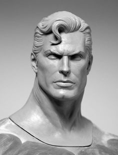 a close up of a statue of a man with blonde hair