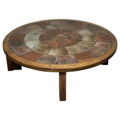 a wooden table with a mosaic design on it