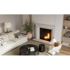 a living room filled with furniture and a fire place in the middle of the room