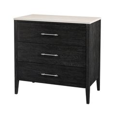 a black and white dresser with three drawers