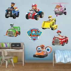 the paw patrol wall decals are all over the room