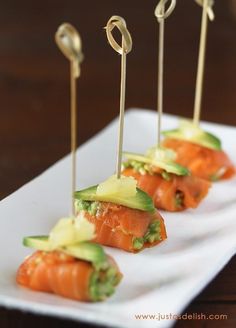 small appetizers are arranged on a white plate