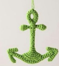 an anchor ornament made out of green beads