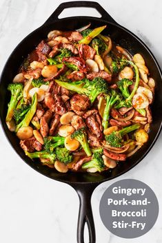 stir fry with broccoli and meat in a skillet on a marble countertop